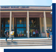 students on steps of large library