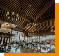 large beautiful room with tables and students